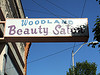 Old time photo of a beauty salon sign